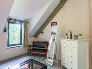 a dressing room with a mirror and a dresser at Holiday Home Les Trois Baudets by Interhome in Elliant +13 photos