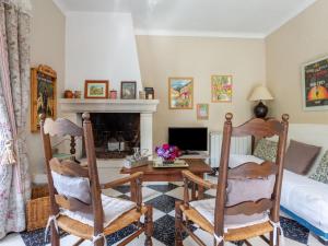 a living room with a desk and a bed at Holiday Home Le Cèdre - MBE101 by Interhome in Ménerbes