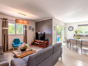 a living room with a couch and a table at Holiday Home Villa Marie-Jo by Interhome in Cervione +21 photos