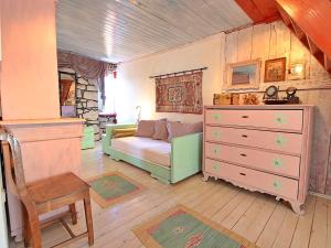 a bedroom with a bed and a dresser in it at Holiday Home Mirna by Interhome in Ložišće