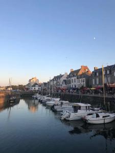 a group of boats are docked in a harbor at 11 Port Lin in Le Croisic