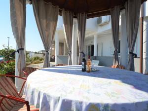 a table with a blue table cloth on a patio at Apartment Ivana-5 by Interhome in Raslina
