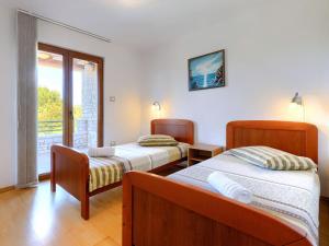 Posteľ alebo postele v izbe v ubytovaní Holiday Home Villa Anamaria by Interhome