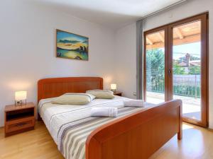 Posteľ alebo postele v izbe v ubytovaní Holiday Home Villa Anamaria by Interhome