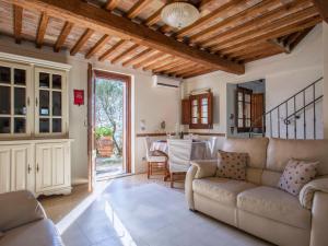 a living room with a couch and a table at Holiday Home Iacopo by Interhome in Pieve a Nievole