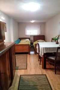 a small room with two beds and a table at Holiday Home Karpacz Kowary by Interhome in Kowary