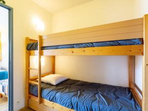 a bunk bed in a room with two bunk beds at Apartment Les Platanes-4 by Interhome in Sainte-Maxime