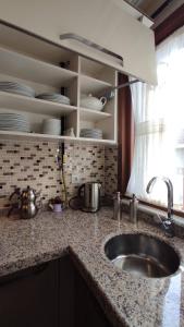 a kitchen counter with a sink and a window at Duplex 41 in the city center of Umraniye Alemdag caddesi Istanbul in Sarıgazi