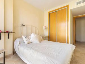 A bed or beds in a room at Apartment Carnaval by Interhome