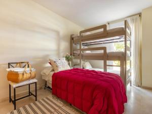 A bed or beds in a room at Apartment Carnaval by Interhome