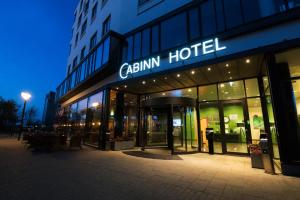 a building with a caininn hotel sign on the front at Cabinn Aalborg in Aalborg