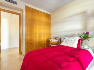 A bed or beds in a room at Apartment Carnaval by Interhome