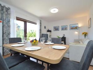 a dining room with a table with wine glasses at Holiday Home Mihotić by Interhome in Murter