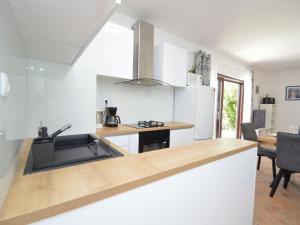 a kitchen with a sink and a counter top at Holiday Home Mihotić by Interhome in Murter +27 photos
