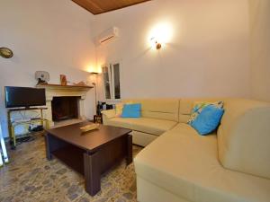 a living room with a couch and a coffee table at Holiday Home Peter by Interhome in Prigradica