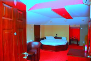 Säng eller sängar i ett rum på HOTEL VILA MITIC LUXX SPA centar
