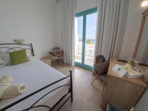 Postel nebo postele na pokoji v ubytování Amaryllis Beach Hotel