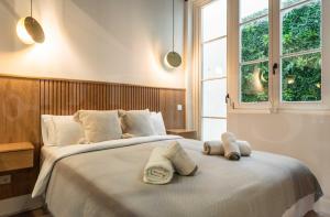 En eller flere senge i et værelse på Premium loft in the heart of Malaga by REMS