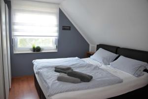 Ein Bett oder Betten in einem Zimmer der Unterkunft Ferienhaus 8erwassereck