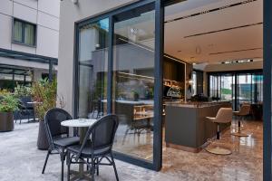 a restaurant with a table and chairs in a building at Livinton İstanbul Ataşehir in Istanbul +61 photos