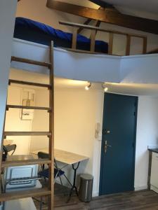 a room with a bunk bed and a desk at Studio Gambetta Republique in Lille