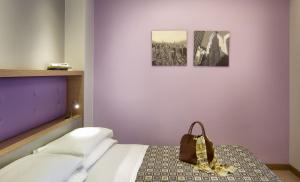 Postel nebo postele na pokoji v ubytování ACasaMia WelcHome Hotel + 37 fotografií