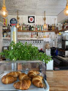 a bunch of loaves of bread sitting on a counter at Complejo Sun's Gardens - Maspalomas in Maspalomas