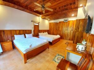 Postel nebo postele na pokoji v ubytování Viet Thanh Resort + 18 fotografií