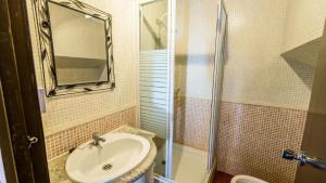 a bathroom with a sink and a shower at Cortijo Vaquero Rural Loja by Ruralidays in Loja +13 photos