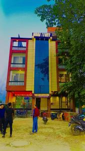 a group of people standing in front of a building at Hotel Shaurya Inn in Lucknow