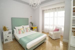 Кровать или кровати в номере La Casa de Santa Florentina - 100 m2