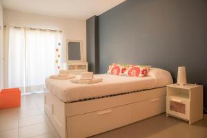 a bedroom with a large bed with drawers and a window at A17 - Heaven Sun Praia da Rocha 1 Bed Apartment in Portimão