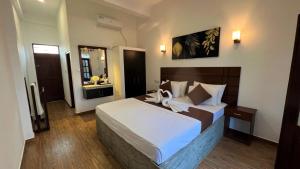 Sea Pink Residence Bentotaにあるベッド