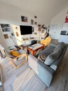 a living room with a couch and a table at HAWAII in Eilat