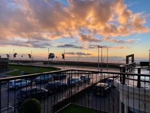 a view of a parking lot with cars parked at Fabrik Apartments - Harrowside by Blackpool Service Apartements in Blackpool