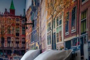 a view of a city street with buildings at Boutique Hotel Four in Geldrop