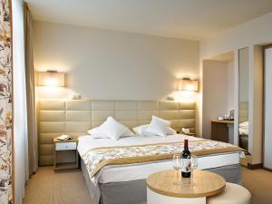 Säng eller sängar i ett rum på Hotel Petropol