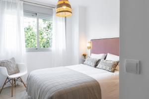 Posteľ alebo postele v izbe v ubytovaní PRECIOSO APARTAMENTO EN MARIA ZAMBRANO