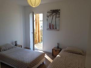 Posteľ alebo postele v izbe v ubytovaní Dune Blanche 300 m de l'Océan, appartement neuf 6 personnes