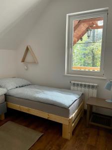 Postel nebo postele na pokoji v ubytování Leśnisko