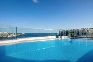 a large swimming pool on top of a building at Plaza Regency Hotels in Sliema