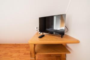 Televízia a/alebo spoločenská miestnosť v ubytovaní Willa Mewa