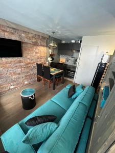 Telewizja i/lub zestaw kina domowego w obiekcie Appt 123 Home Club Tignes