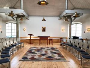 an empty room with a table and chairs at Stjärnholmsslott in Nyköping