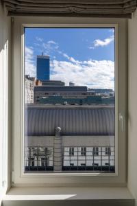 a window with a view of a city skyline at Smartflats - Rogier Brussels in Brussels