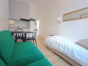 a bedroom with a bed and a table and chairs at L Ajax Airport Bitwy Warszawskiej in Warsaw