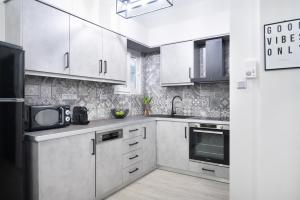 Kuchyňa alebo kuchynka v ubytovaní apt Eleven - cozy apartment with garden