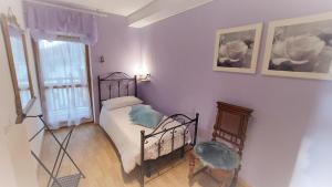 Posteľ alebo postele v izbe v ubytovaní Le Rondini di Casa Bernardi, sole e natura sulle Dolomiti Wi-Fi PetFriendly