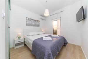 Posteľ alebo postele v izbe v ubytovaní Intimate secluded Luxury Villa Cambello, GORGEOUS SEA VIEW in Croatia