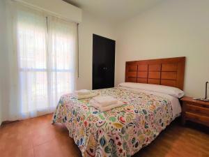 Posteľ alebo postele v izbe v ubytovaní Apartamento Julio Pellicer